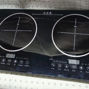 Double burner induction cooker with touch control panel and sleek black glass surface.
