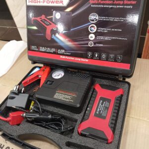 High-Power Jump Starter Kit with LED light, USB ports, air compressor, and cables in carry case.